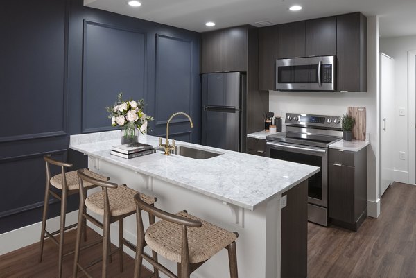 Spacious kitchen with modern appliances at The Fitz Apartments