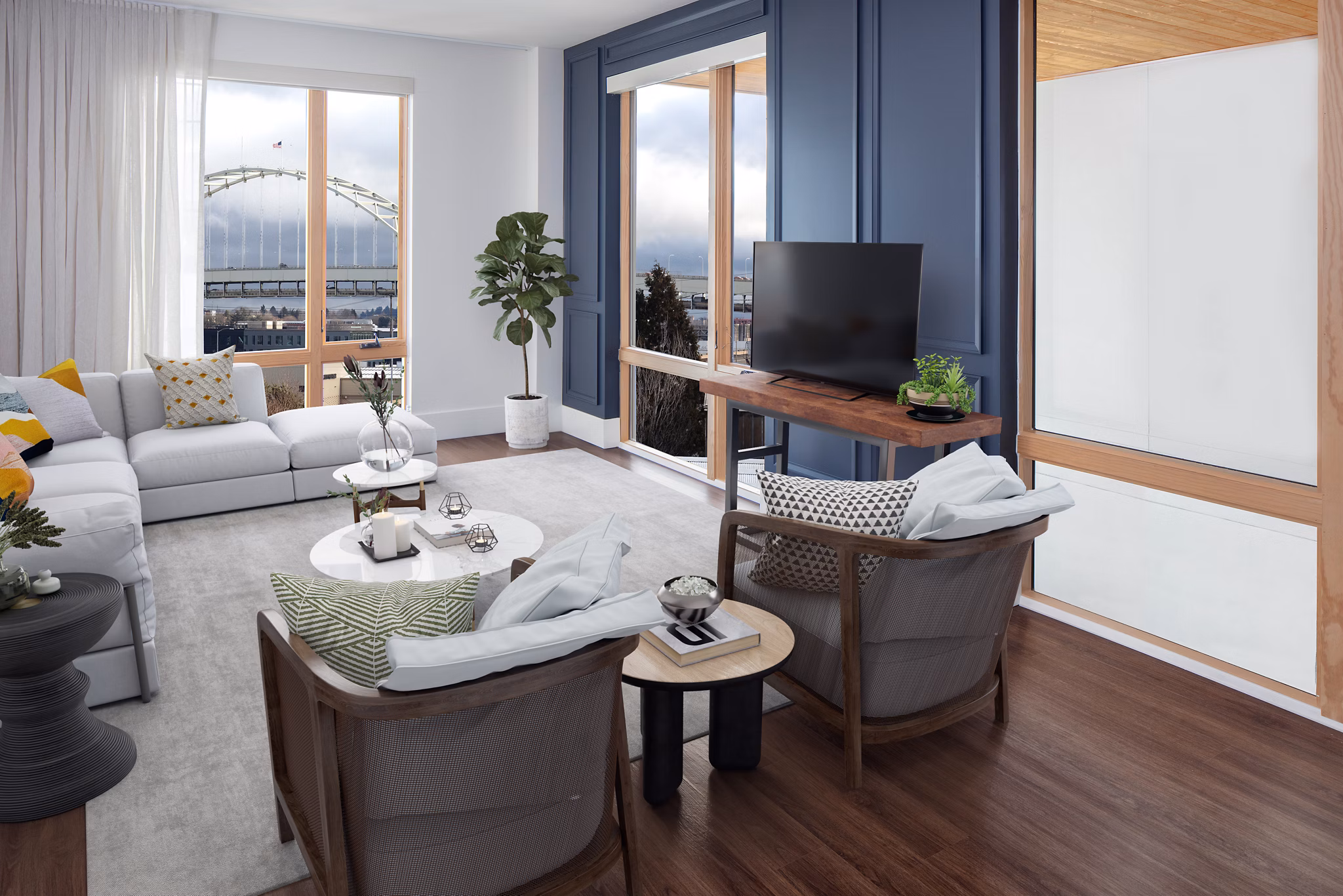 Spacious living room with modern decor and large windows in The Fitz Apartments