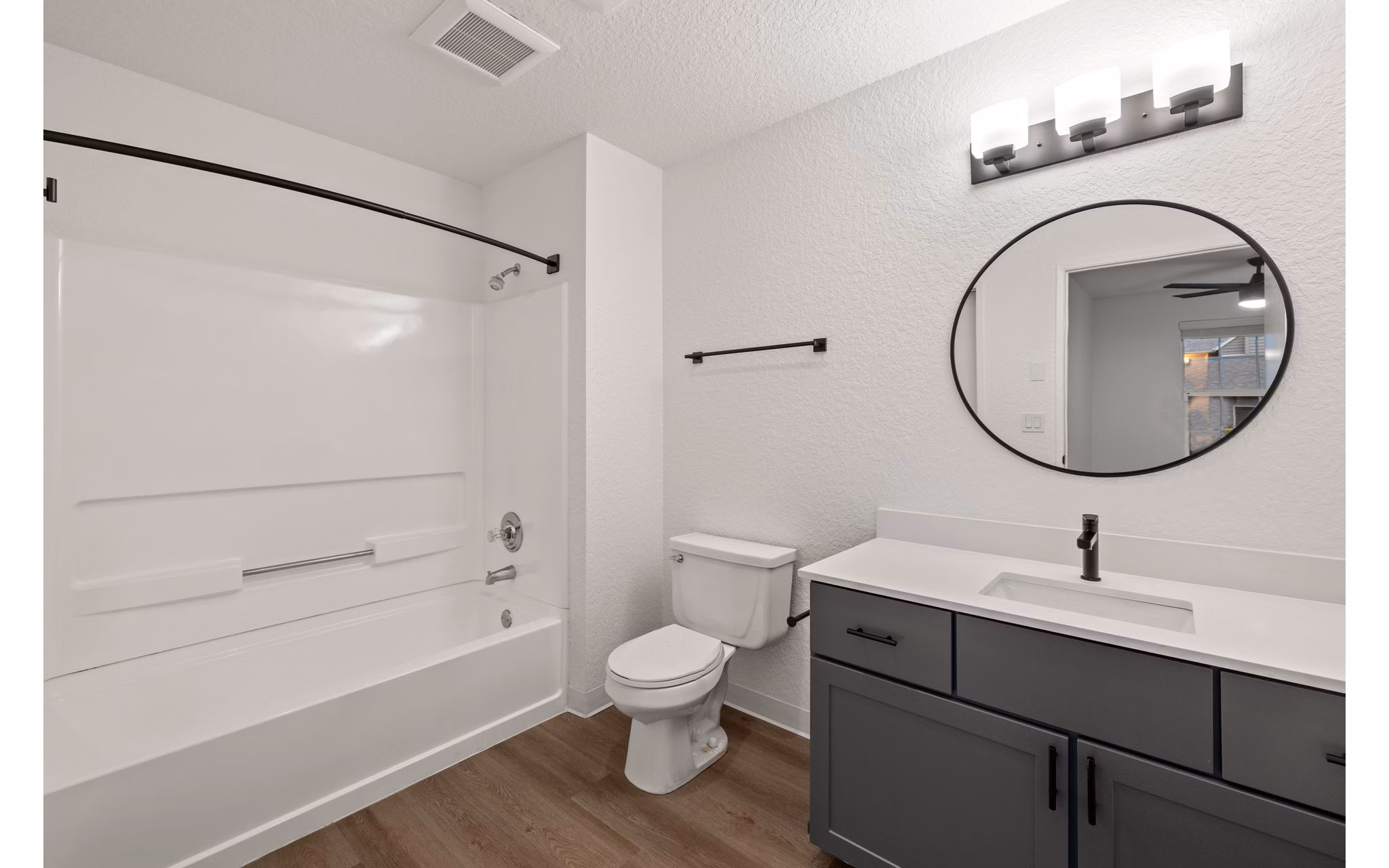 Bathroom featuring elegant marble countertops at Larkspur Place Apartments
