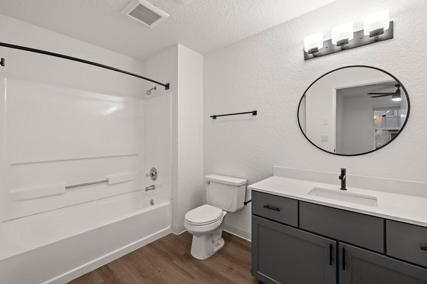 Bathroom featuring elegant marble countertops at Larkspur Place Apartments