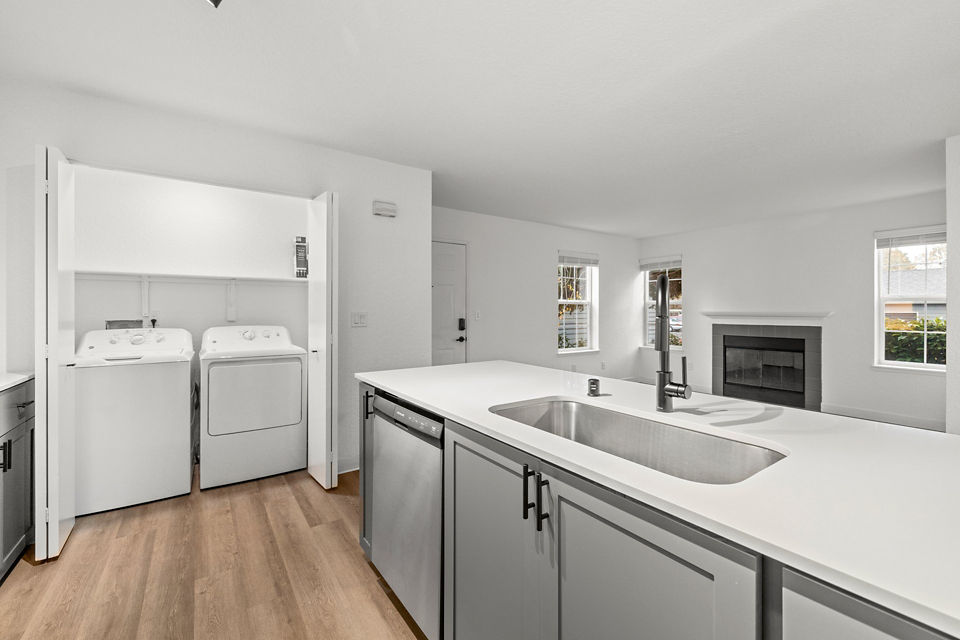 Modern kitchen with stainless steel appliances at Larkspur Place Apartments