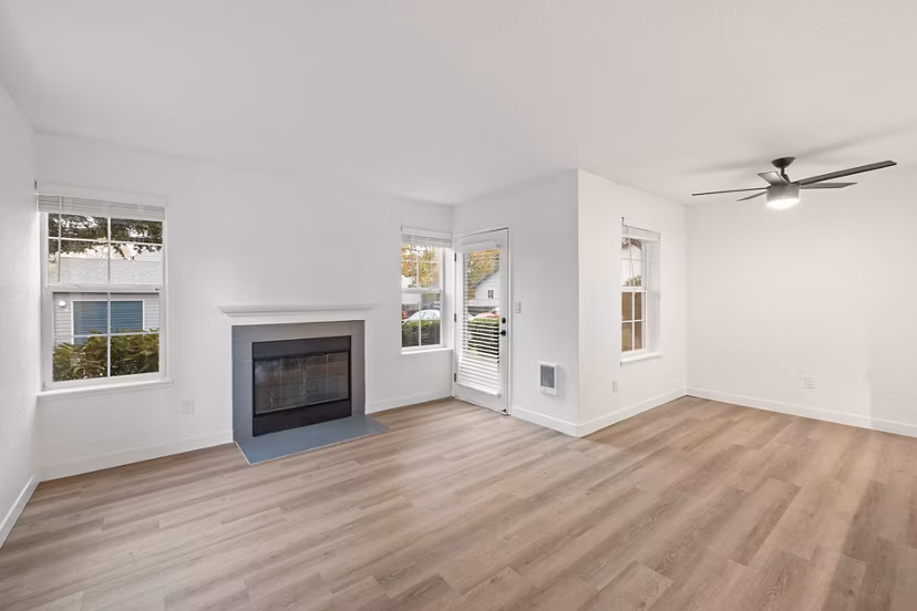 Spacious living room with modern decor in Larkspur Place Apartments living room