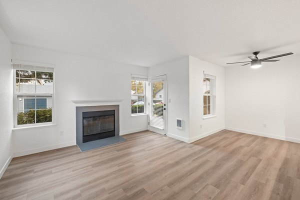 Spacious living room with modern decor in Larkspur Place Apartments living room