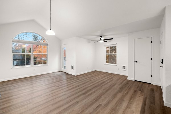 Spacious living room with modern decor in Larkspur Place Apartments