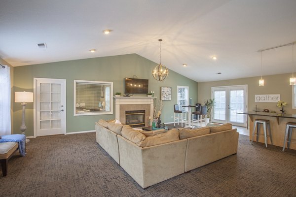 Cozy living room with modern furnishings at Larkspur Place Apartments, featuring natural light and open layout