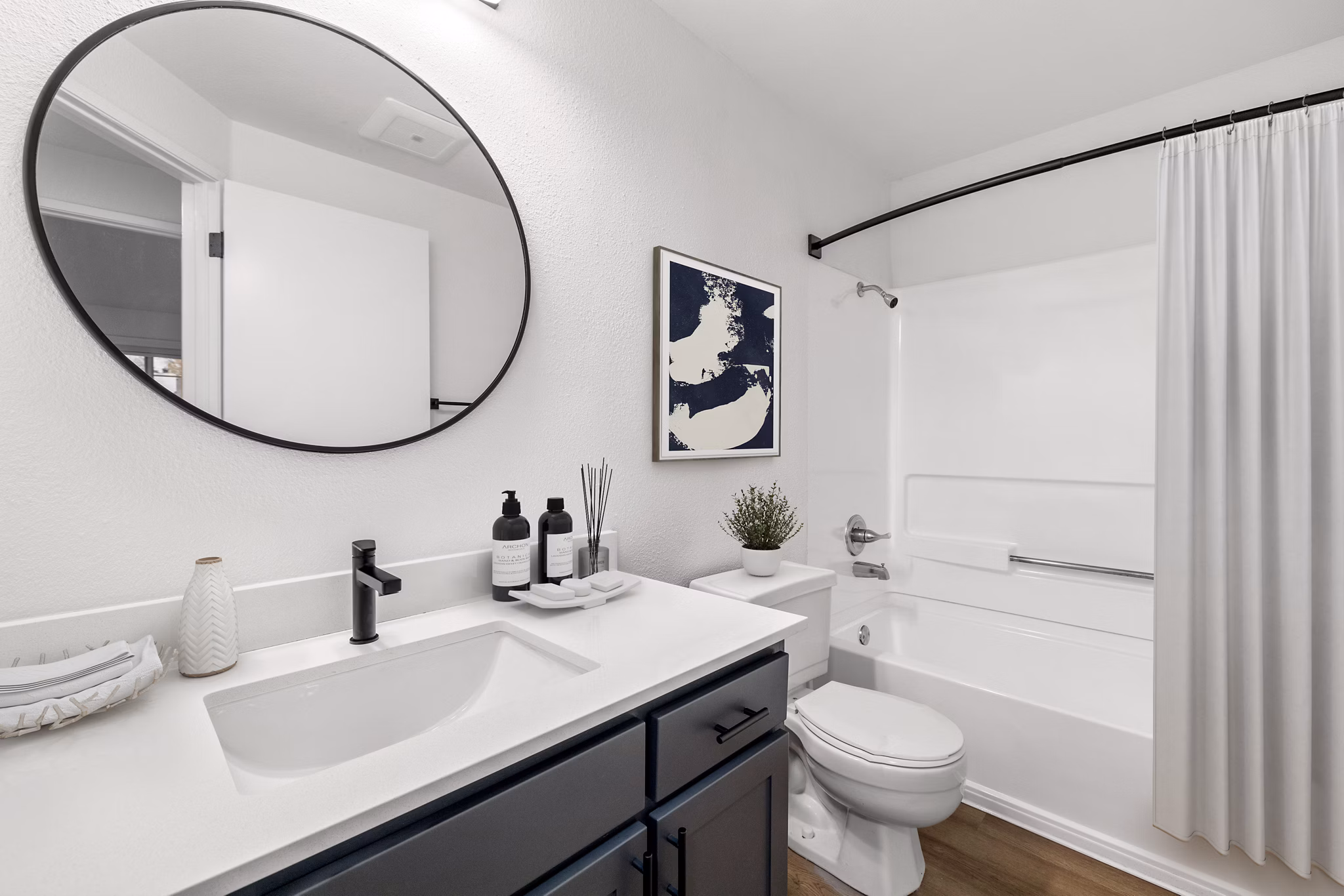 Bathroom featuring sleek fixtures and granite countertops at Sedona at Bridgecreek Apartments