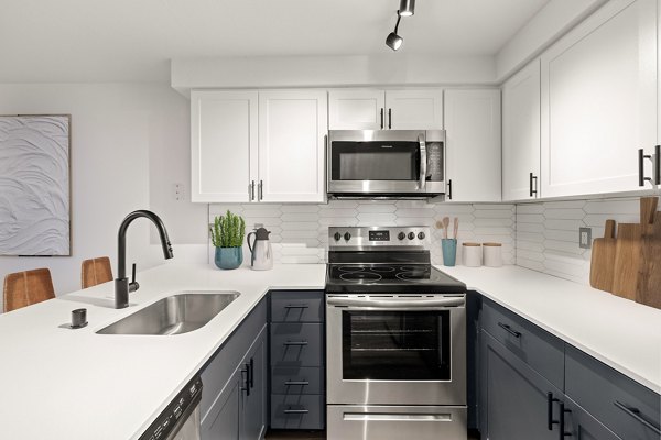 Modern kitchen featuring stainless steel appliances in Sedona at Bridgecreek Apartments