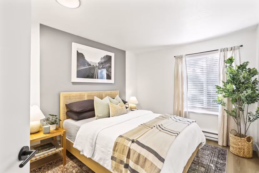 Cozy bedroom with modern decor and natural lighting in Silver Oak Apartments