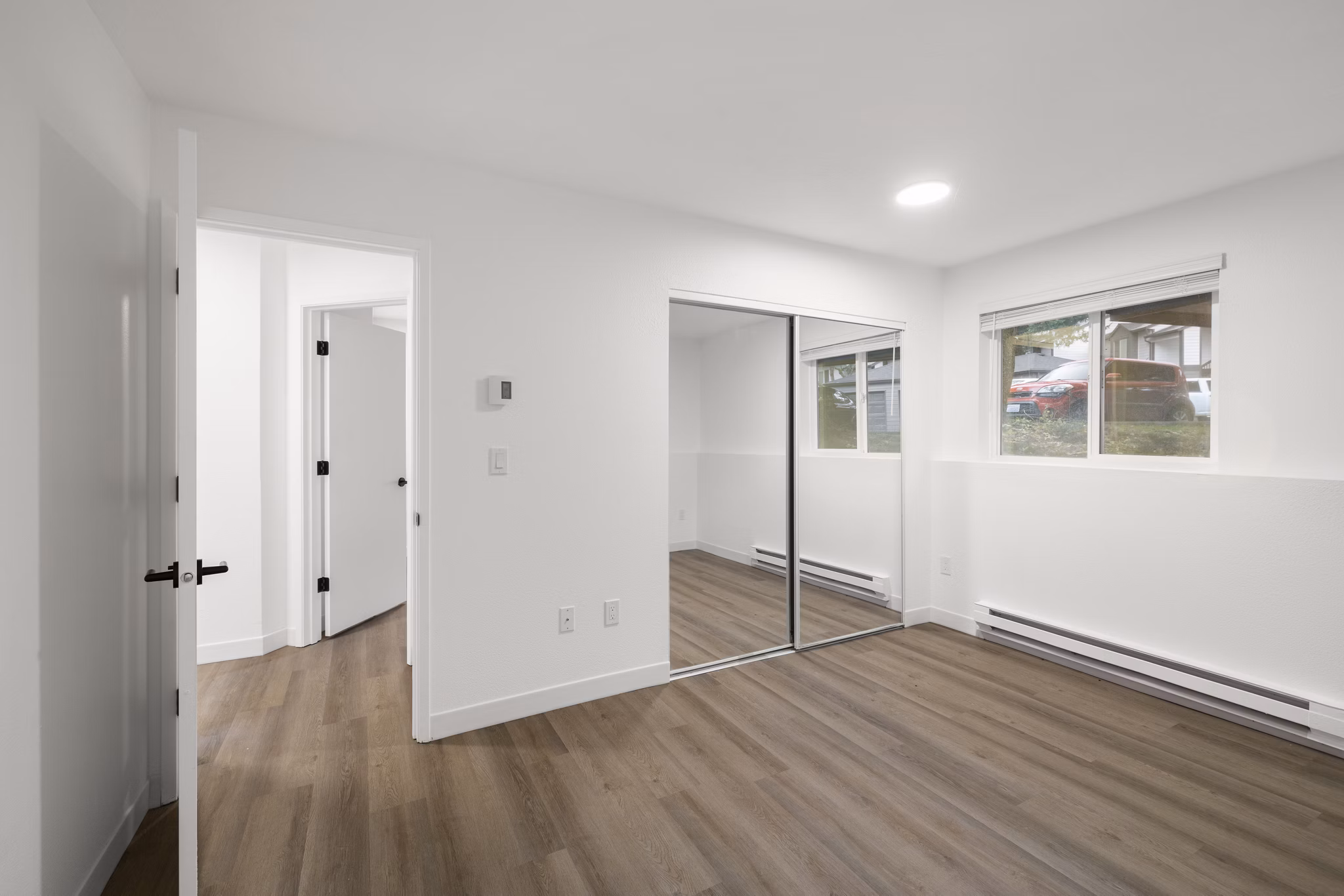 Cozy bedroom with modern decor and natural lighting in Silver Oak Apartments