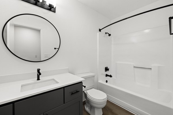 Bathroom featuring sleek fixtures and modern design at Silver Oak Apartments