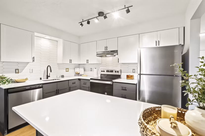 Modern kitchen with stainless steel appliances at Silver Oak Apartments