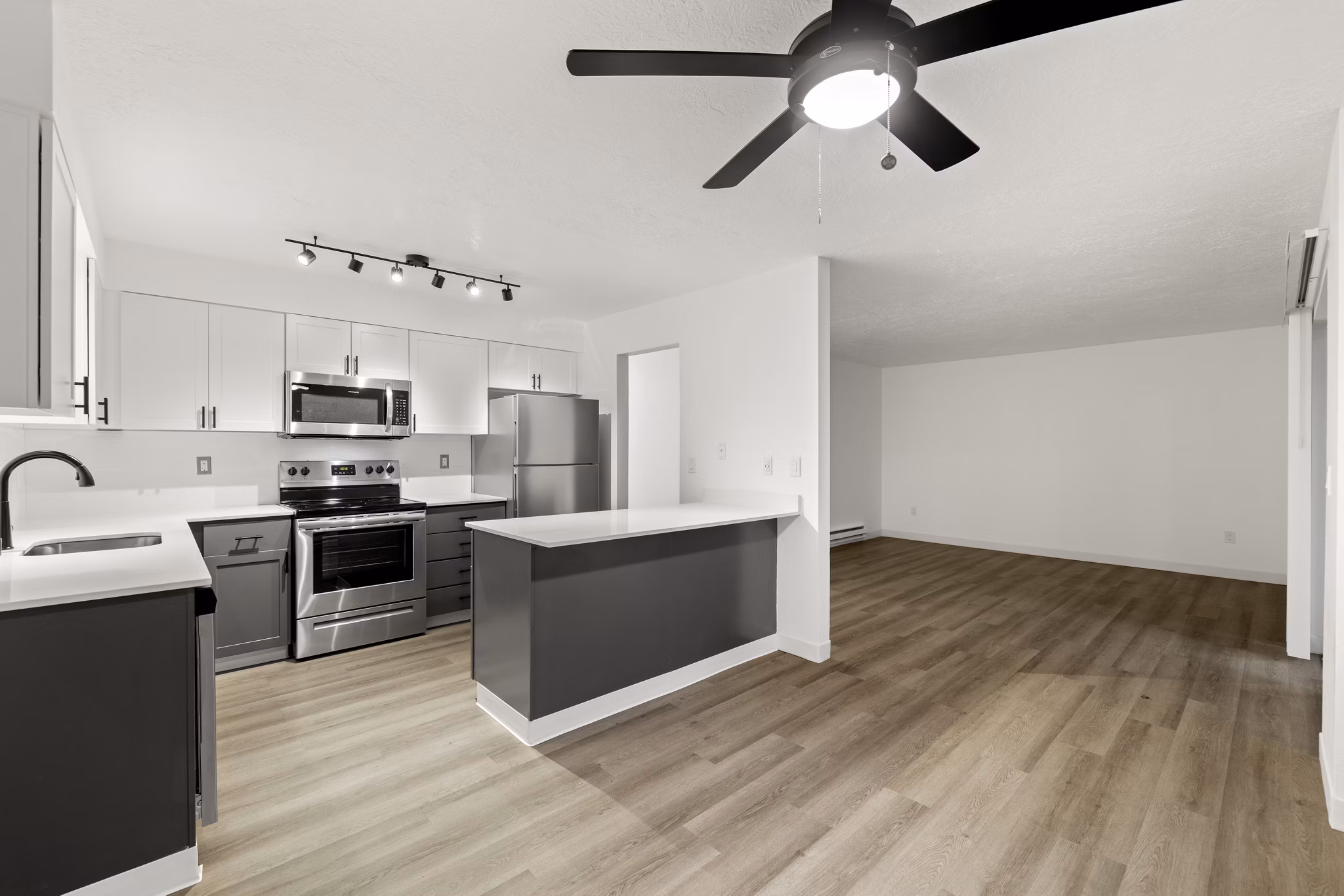 Modern kitchen with stainless steel appliances at Silver Oak Apartments