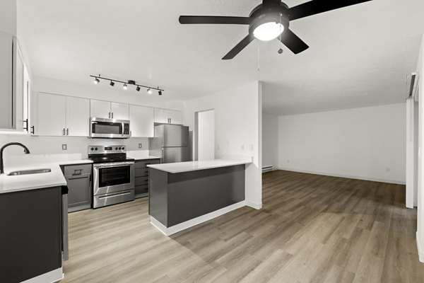 Modern kitchen with stainless steel appliances at Silver Oak Apartments