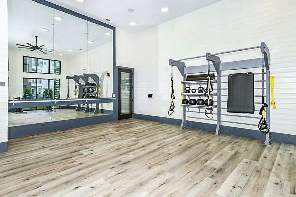 fitness center at The Residences at SweetBay Apartments