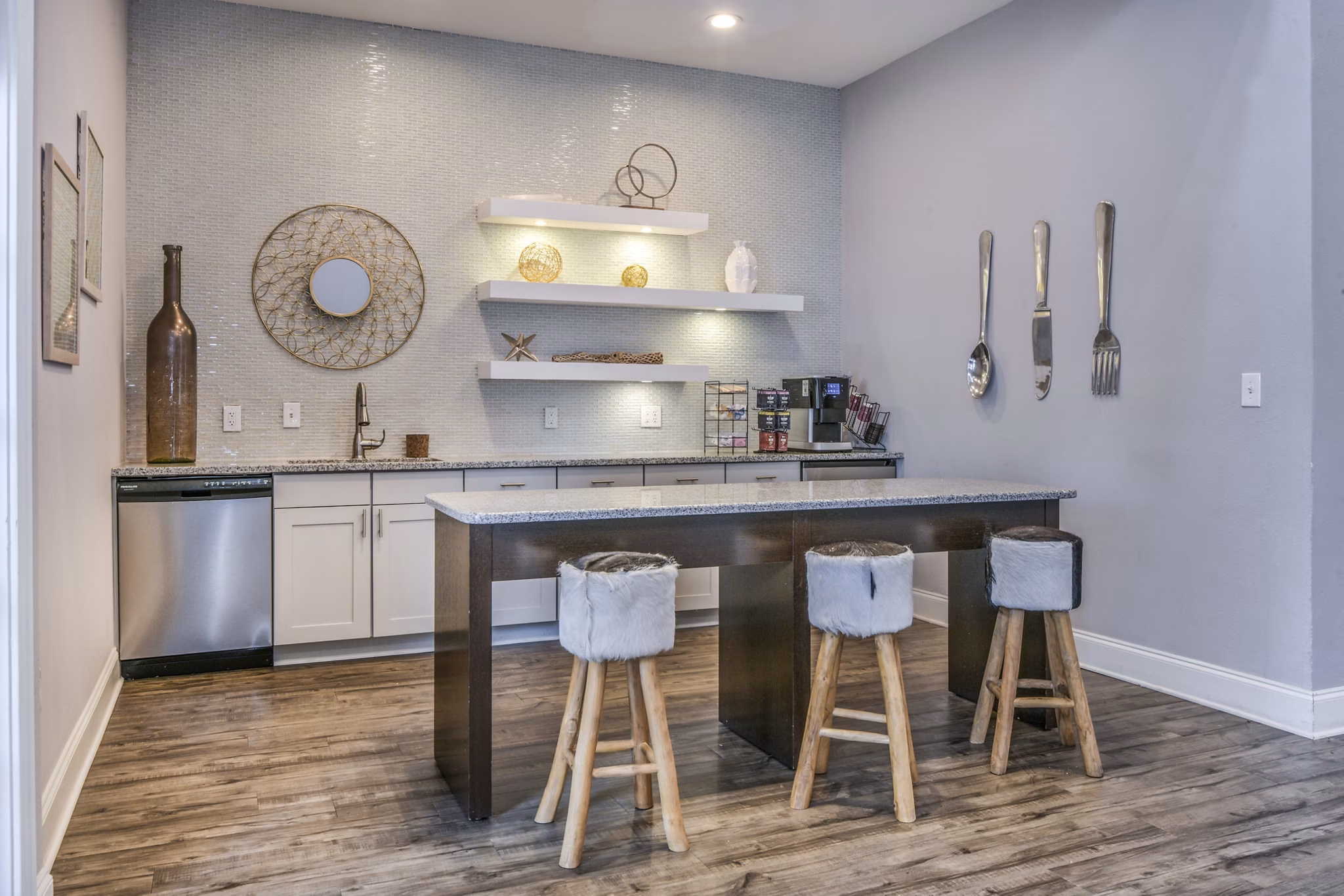 Modern kitchen with sleek countertops and stylish stools in luxury apartments