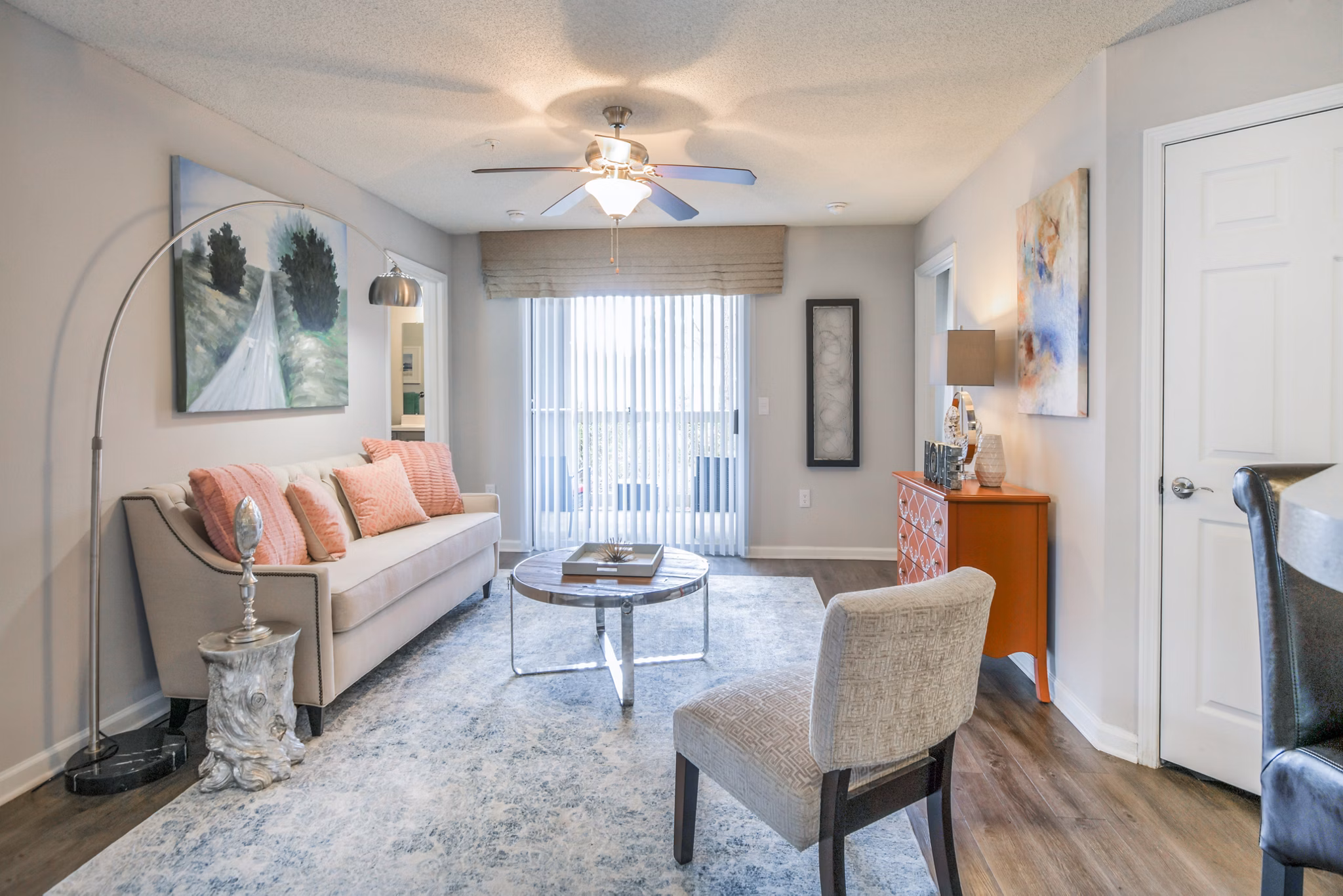 Modern living room featuring stylish sofa, chairs, and decor in luxury apartment