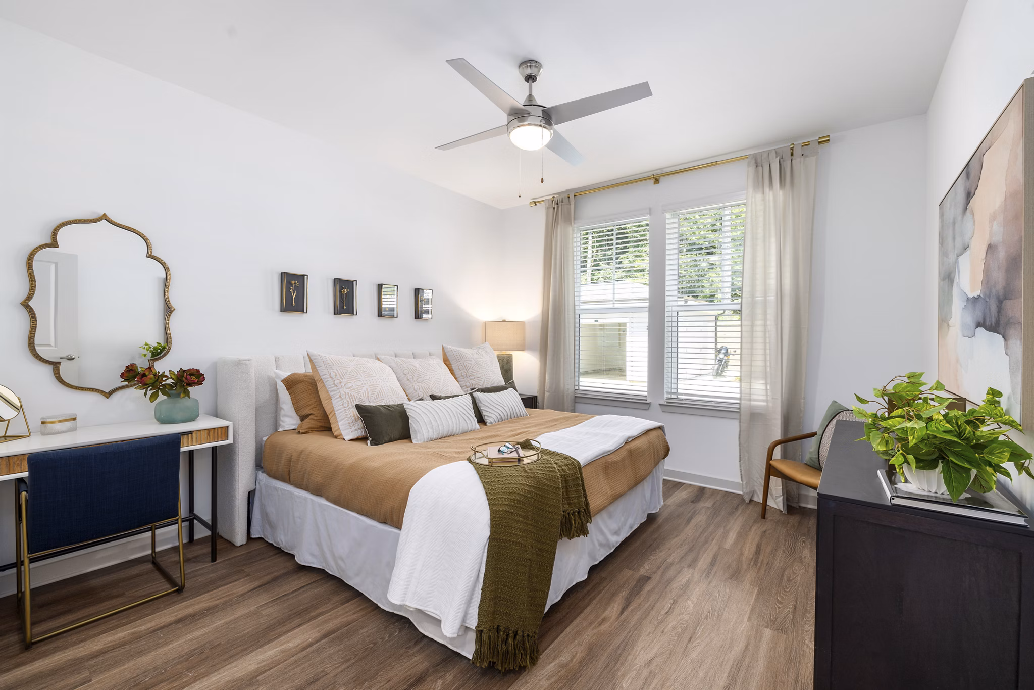 Cozy bedroom with modern decor and ample natural light at Overture Tributary Apartments