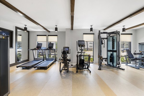 State-of-the-art fitness center at Overture Tributary Apartments featuring modern gym equipment