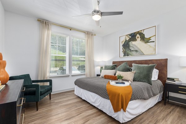 Modern bedroom with elegant decor at Overture Tributary Apartments
