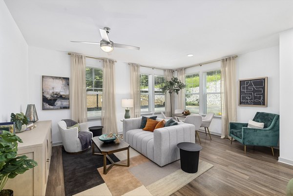 Modern living room with luxury finishes at Overture Tributary Apartments, spacious design ideal for comfort and style