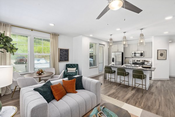 Elegant living room with modern decor in Overture Tributary Apartments, a luxury Greystar community
