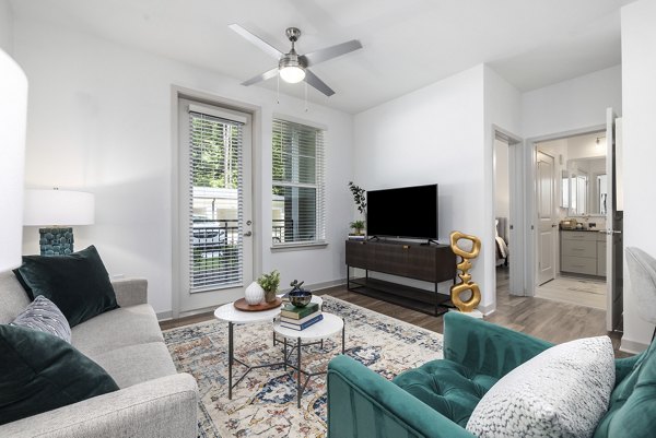 Spacious living room with modern decor at Overture Tributary Apartments