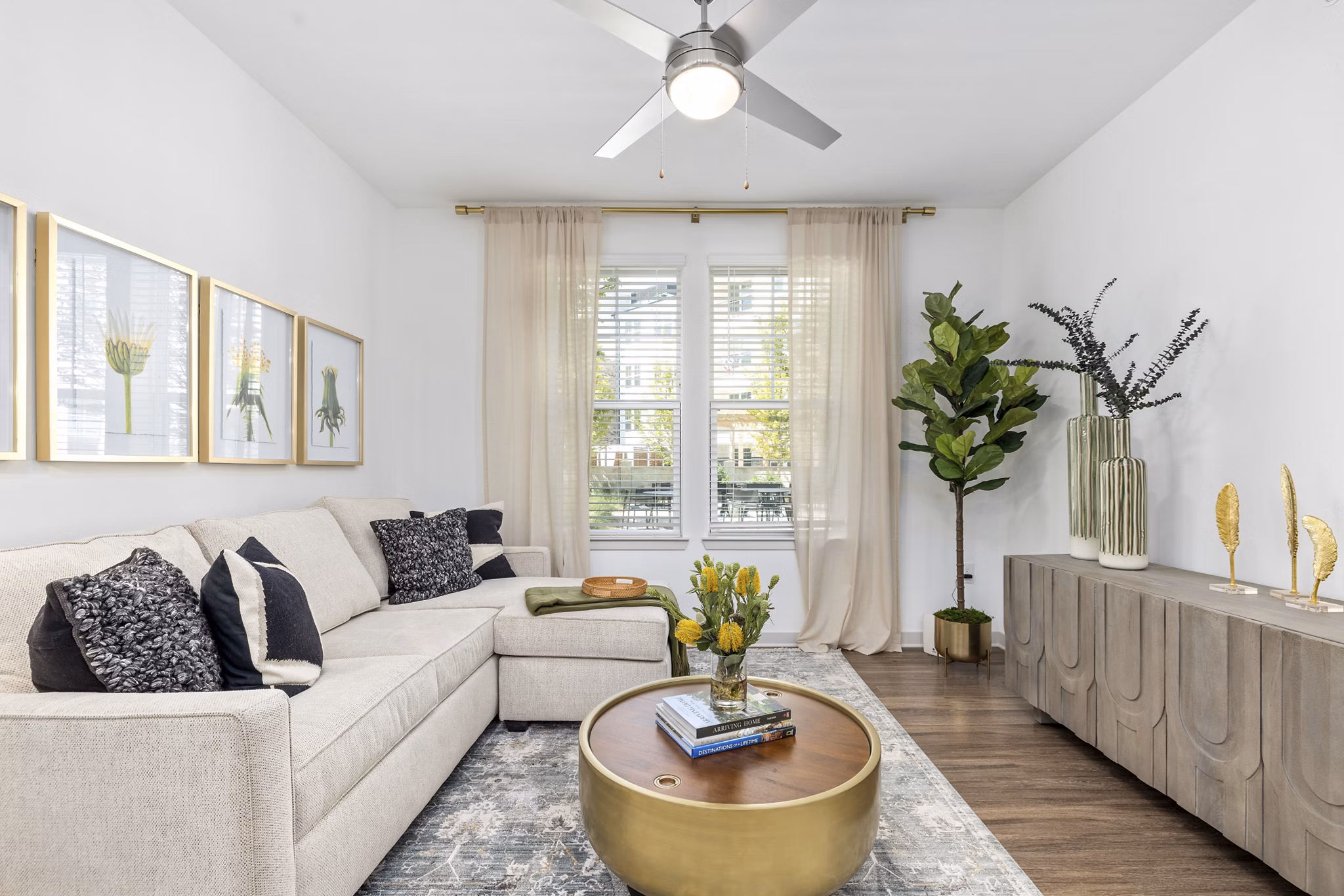 Spacious living room with modern decor and large windows in Overture Tributary Apartments