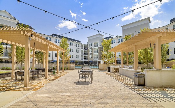 Courtyard area with modern seating and landscaping at Overture Tributary Apartments, ideal for luxury outdoor relaxation