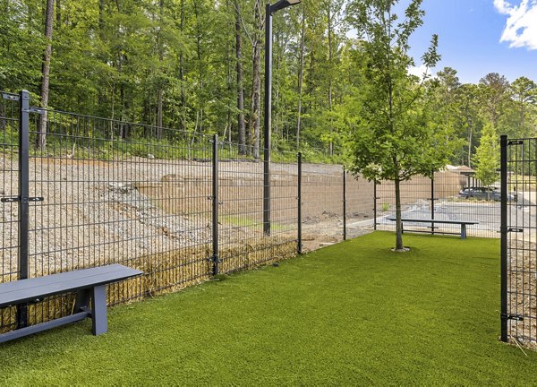 Dog park with agility equipment at Overture Tributary Apartments, a  luxury community