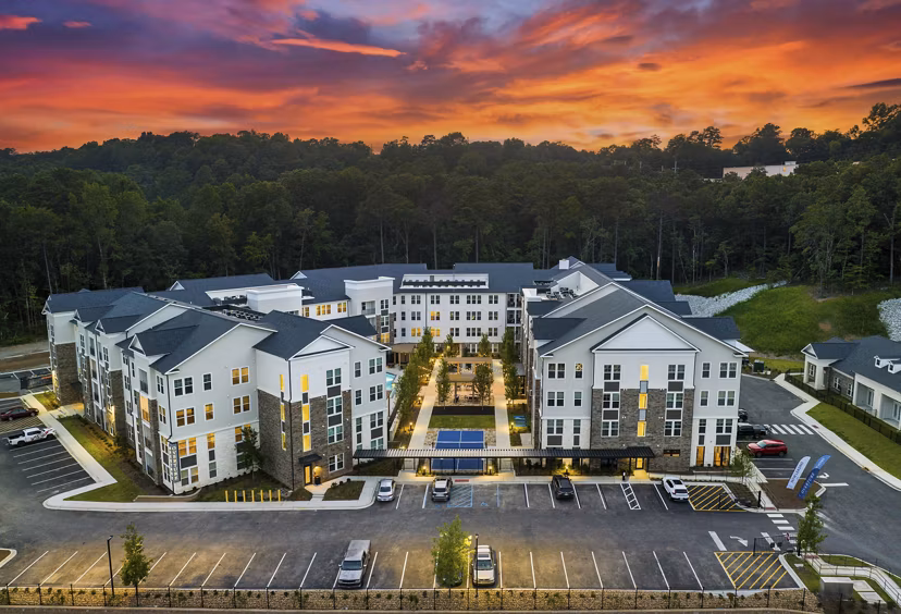 Scenic courtyard view at Overture Tributary Apartments featuring lush landscaping and modern design elements