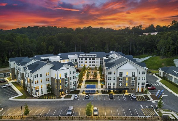 Scenic courtyard view at Overture Tributary Apartments featuring lush landscaping and modern design elements