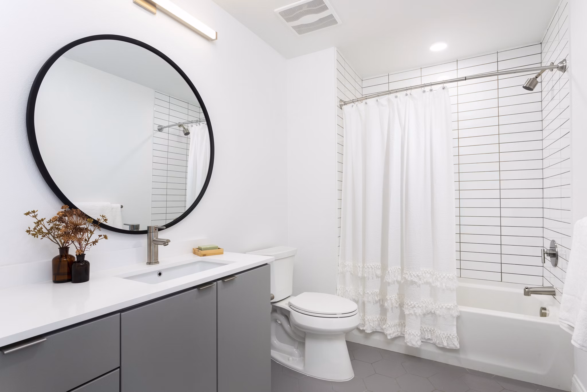 Elegant bathroom with modern fixtures at The Charlie SM C&B Apartments, offering luxury living amenities