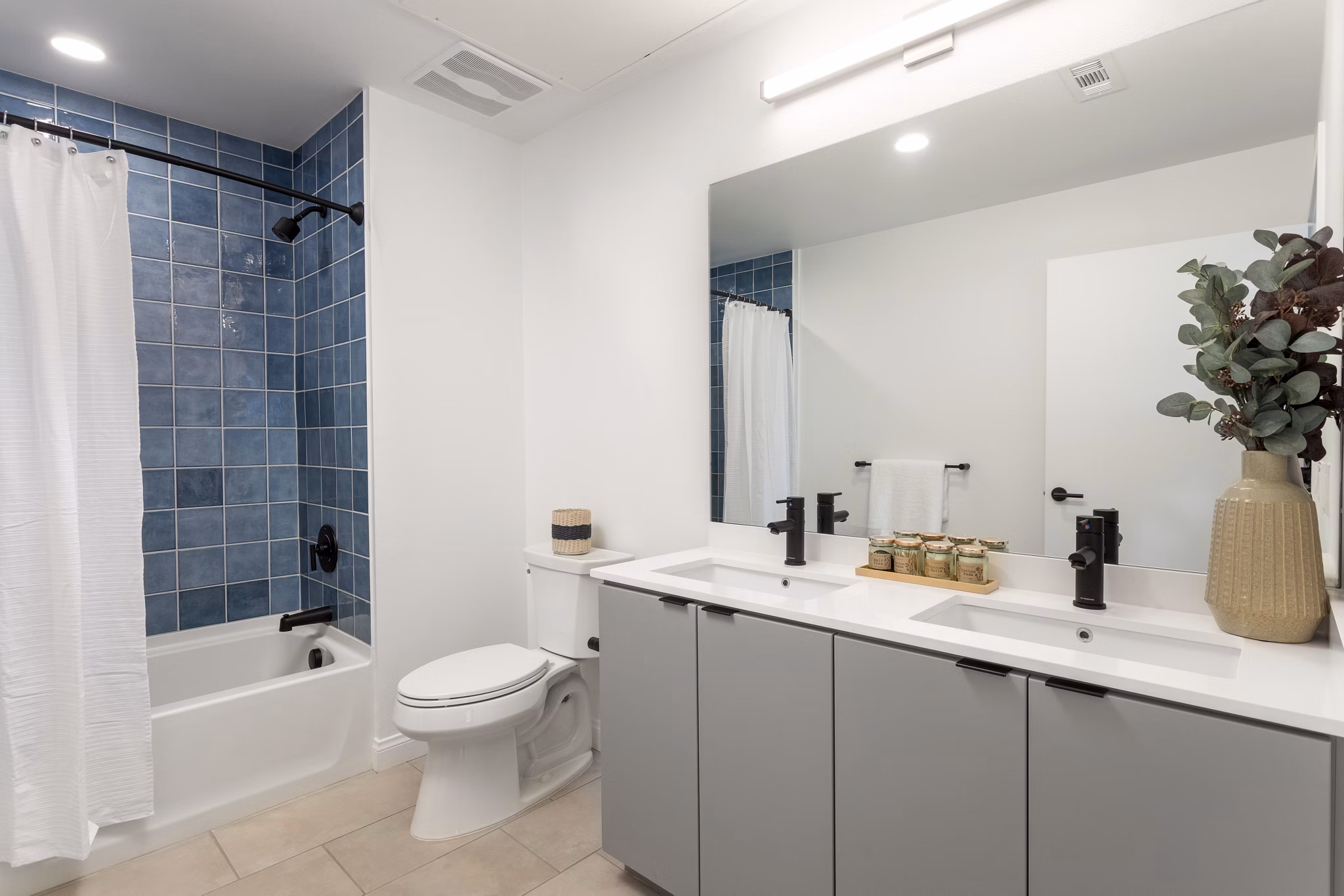 Bathroom with modern fixtures at The Charlie SM C&B Apartments
