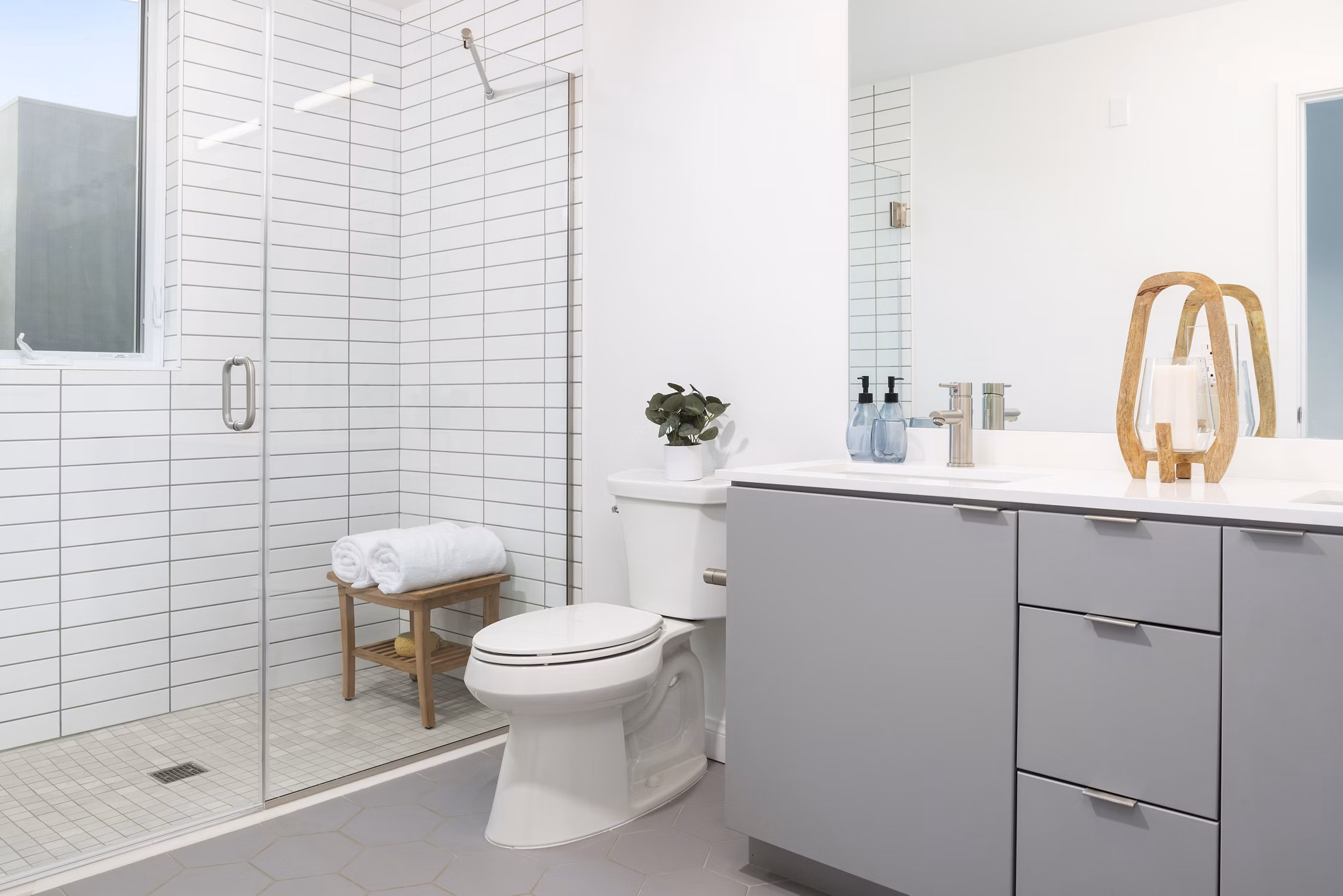 Modern bathroom with sleek fixtures and marble countertop in The Charlie San Mateo luxury apartments