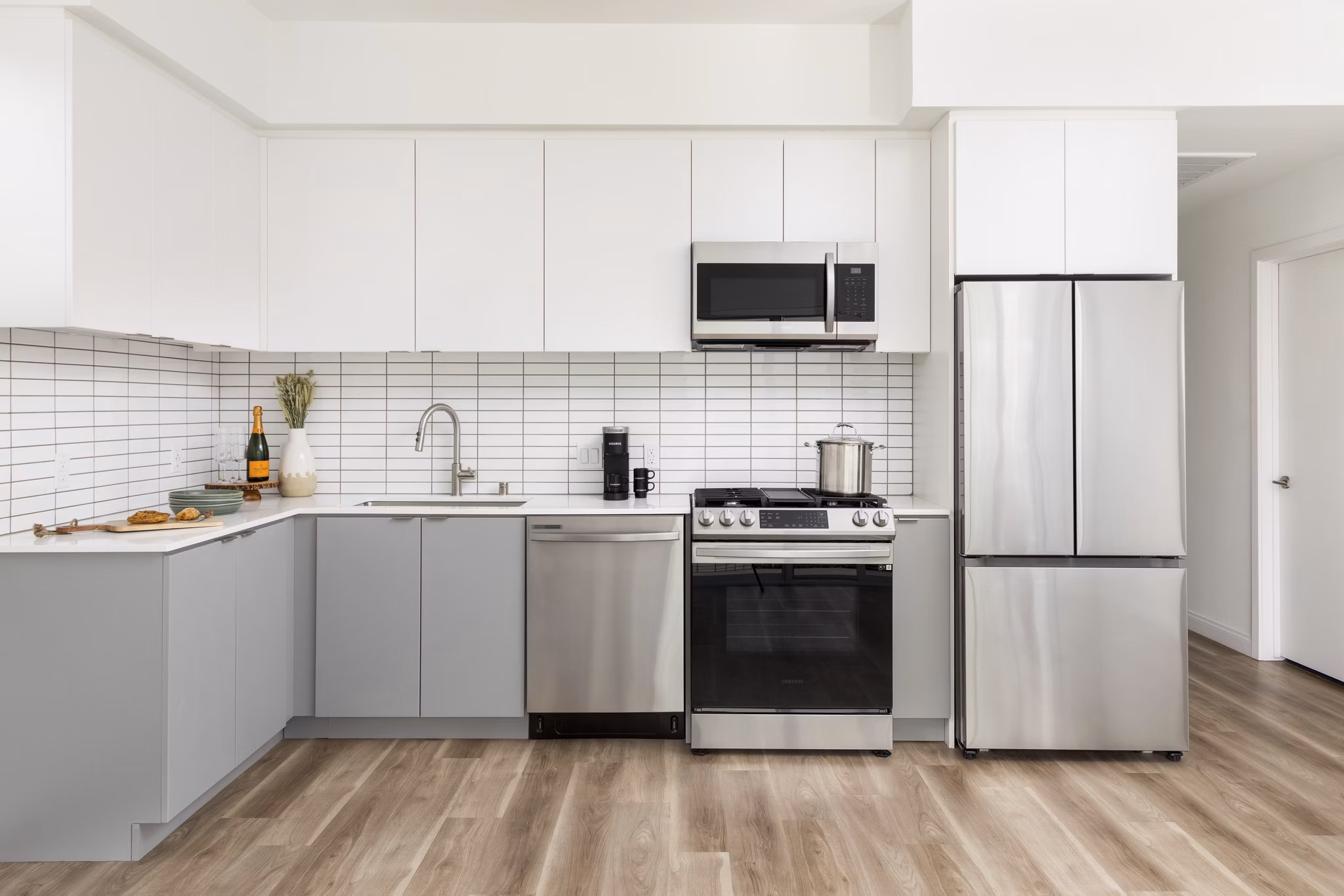 Modern kitchen with stainless steel appliances at The Charlie SM C&B Apartments luxury apartments