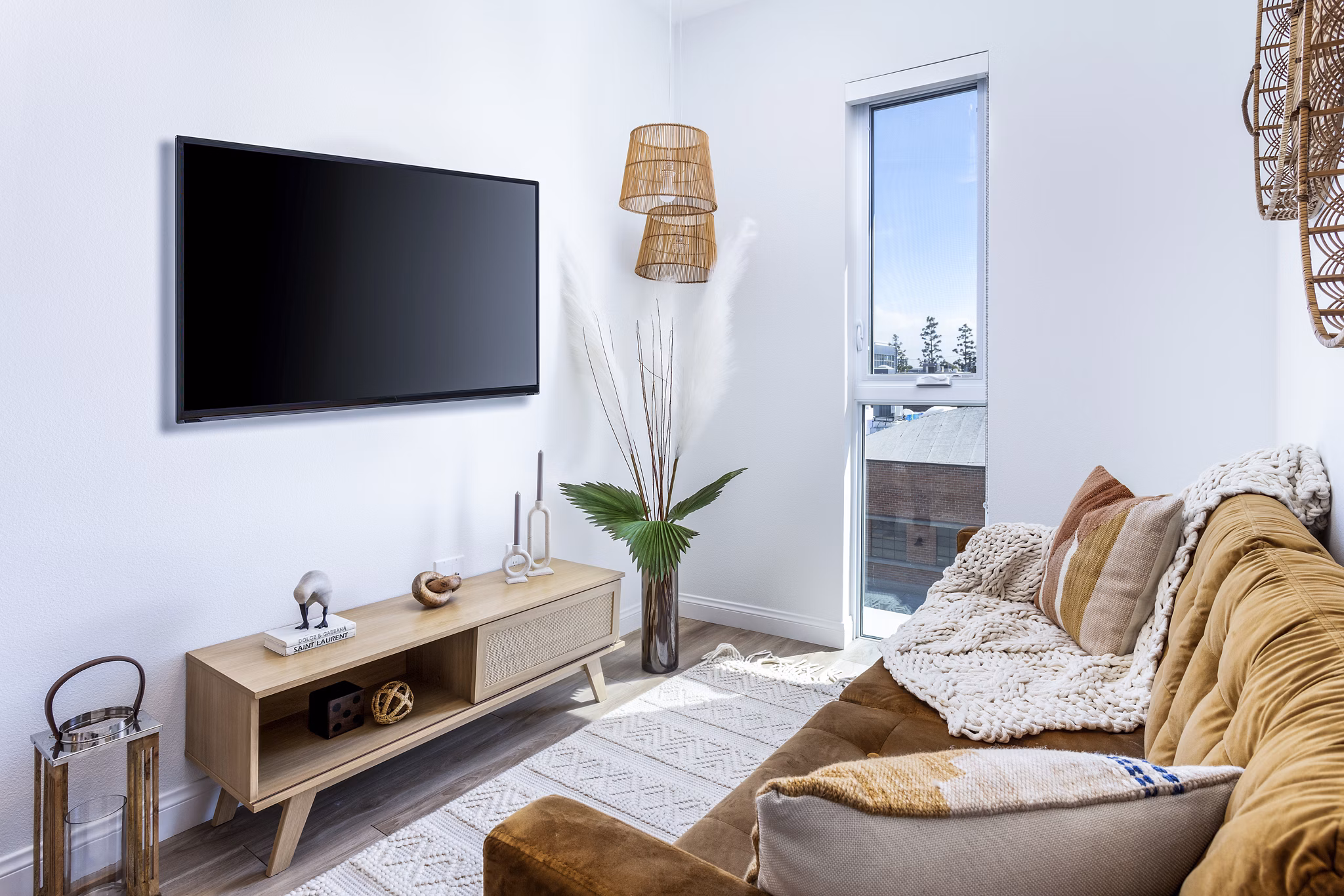 Spacious living room with modern decor in The Charlie SM C&B Apartments