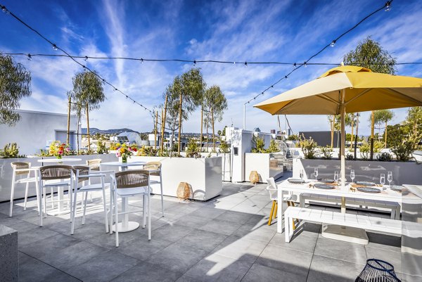 Grill area and cozy patio at The Charlie SM C&B Apartments offering luxury outdoor dining spaces