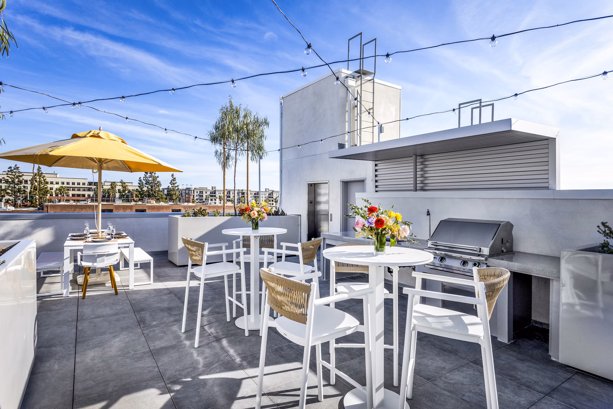 Spacious grill area on a stylish patio at The Charlie SM C&B Apartments, ideal for outdoor gatherings and dining
