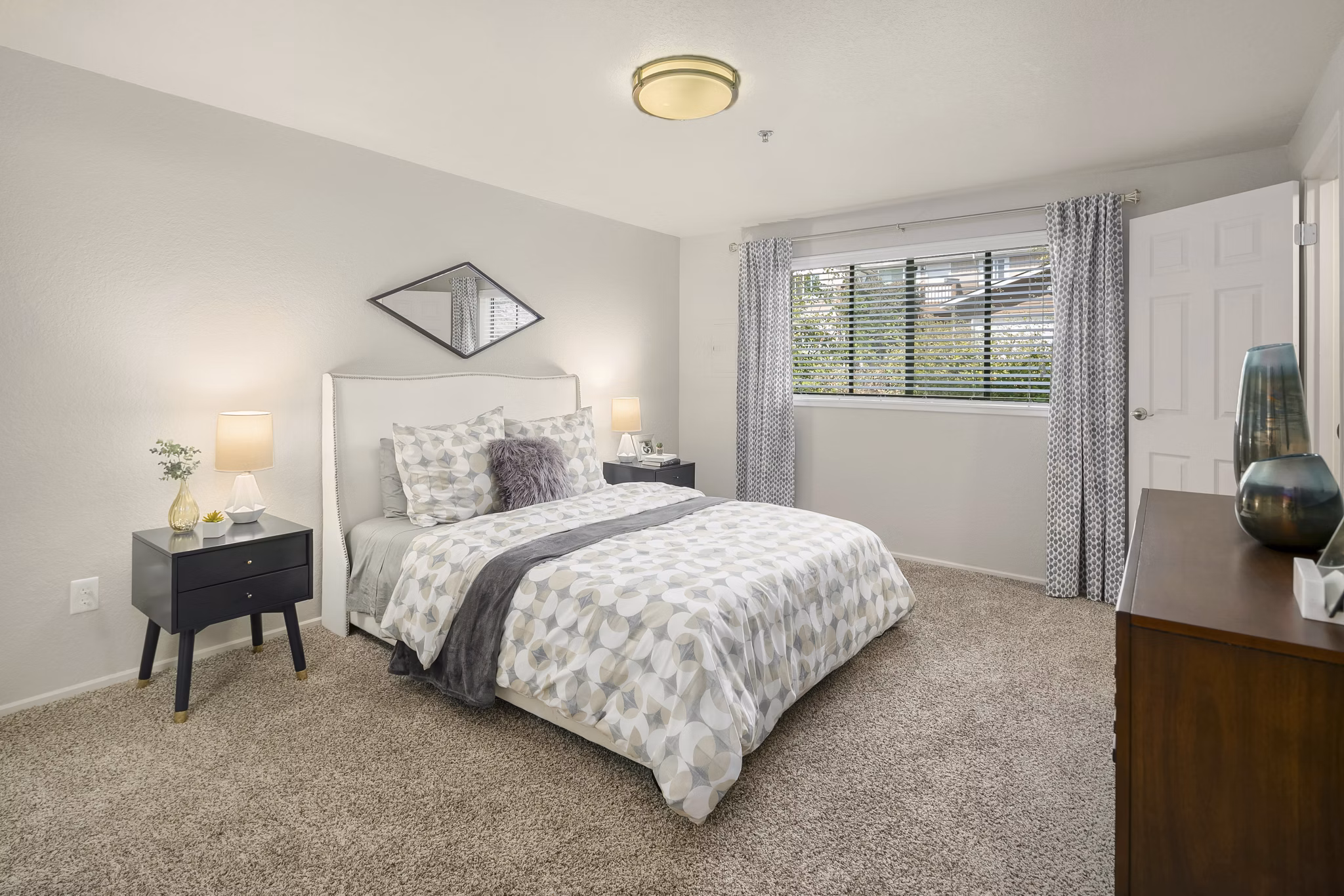 Cozy bedroom with modern furnishings at Skyview 3322 Apartments