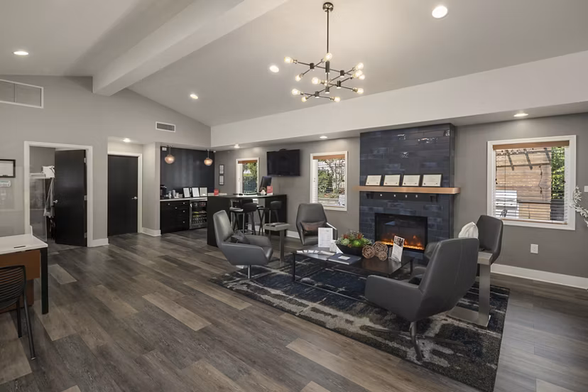 Clubhouse at Skyview 3322 Apartments featuring modern design, cozy seating, and entertainment space