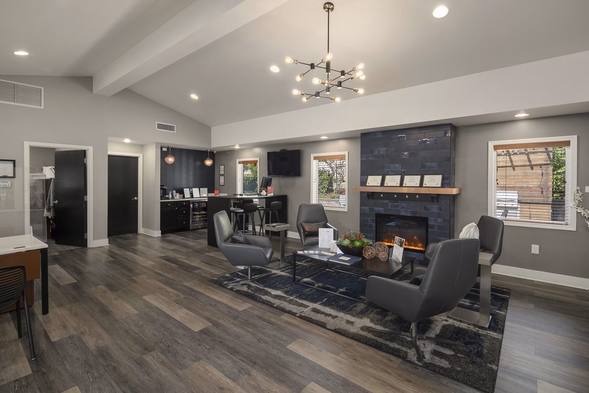 Clubhouse at Skyview 3322 Apartments featuring modern design, cozy seating, and entertainment space