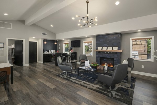 Clubhouse at Skyview 3322 Apartments featuring modern design, cozy seating, and entertainment space