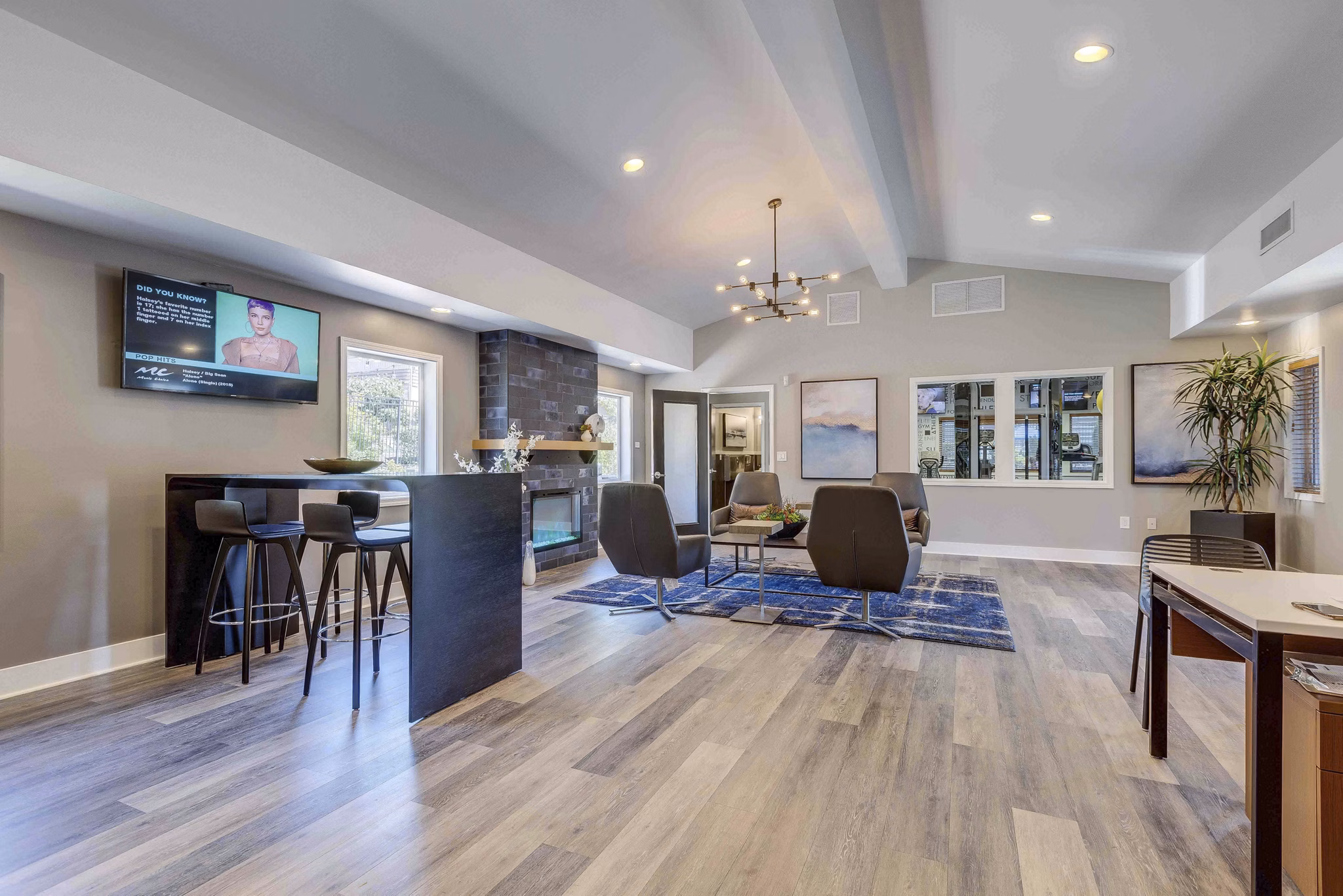 Modern clubhouse featuring comfortable seating and entertainment areas at Skyview 3322 Apartments luxury community