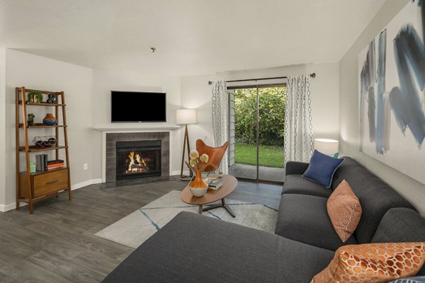 Modern living room with a sectional sofa and city views at Skyview 3322 Apartments
