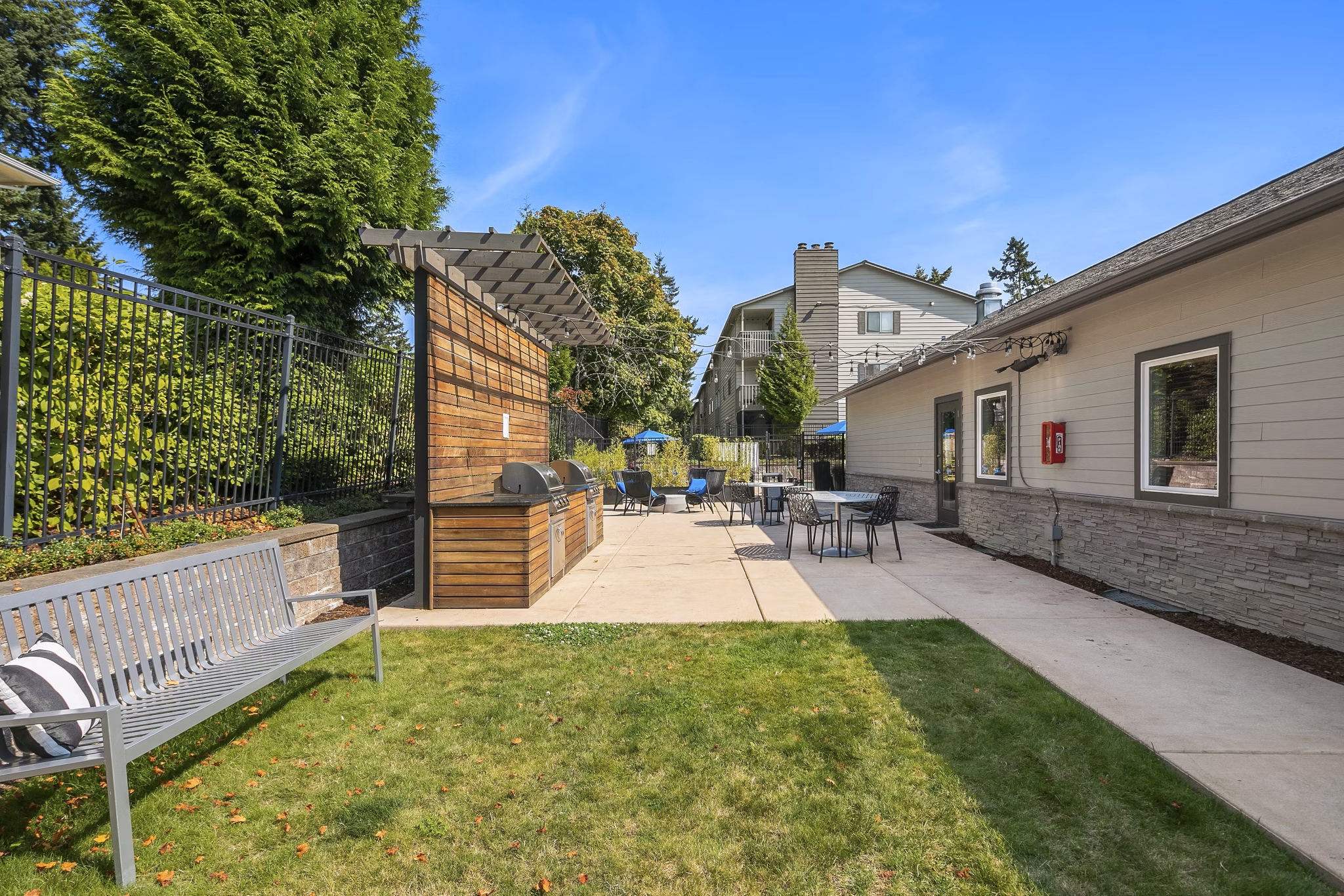 Spacious outdoor patio with modern furniture at Skyview 3322 Apartments, perfect for relaxation and gatherings