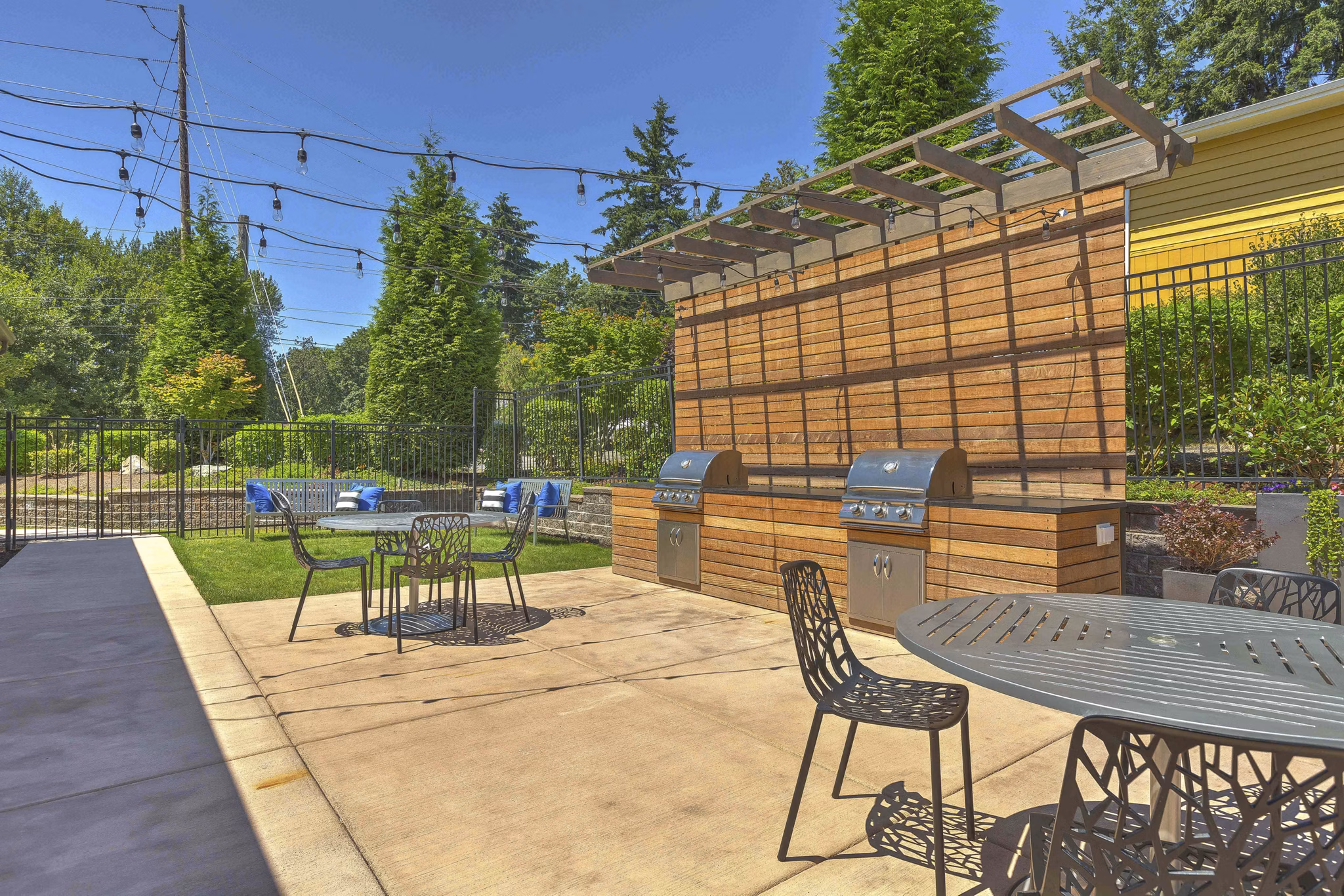 Outdoor grilling and dining area at Skyview 3322 Apartments offering a perfect spot for gatherings and barbecues