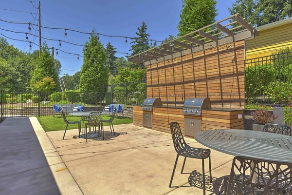 Outdoor grilling and dining area at Skyview 3322 Apartments offering a perfect spot for gatherings and barbecues