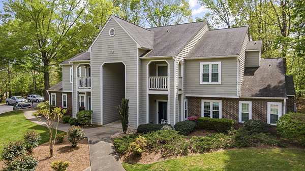 North Forest Apartments: Stylish view of luxury apartments in a serene wooded area, ideal for modern living