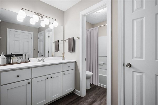 Bathroom featuring modern fixtures and elegant design at North Forest Apartments