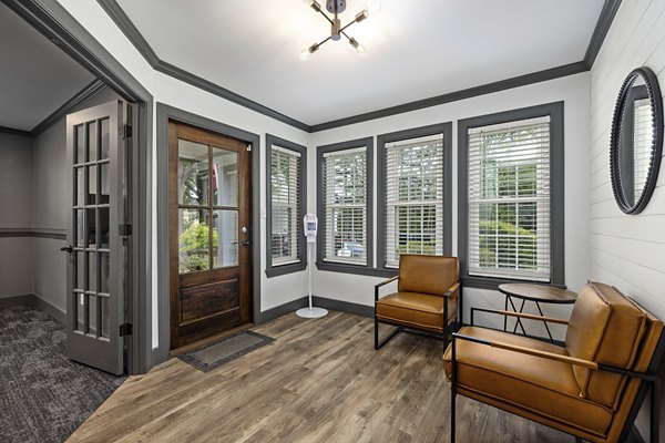 Clubhouse featuring modern design and lounge areas at North Forest Apartments